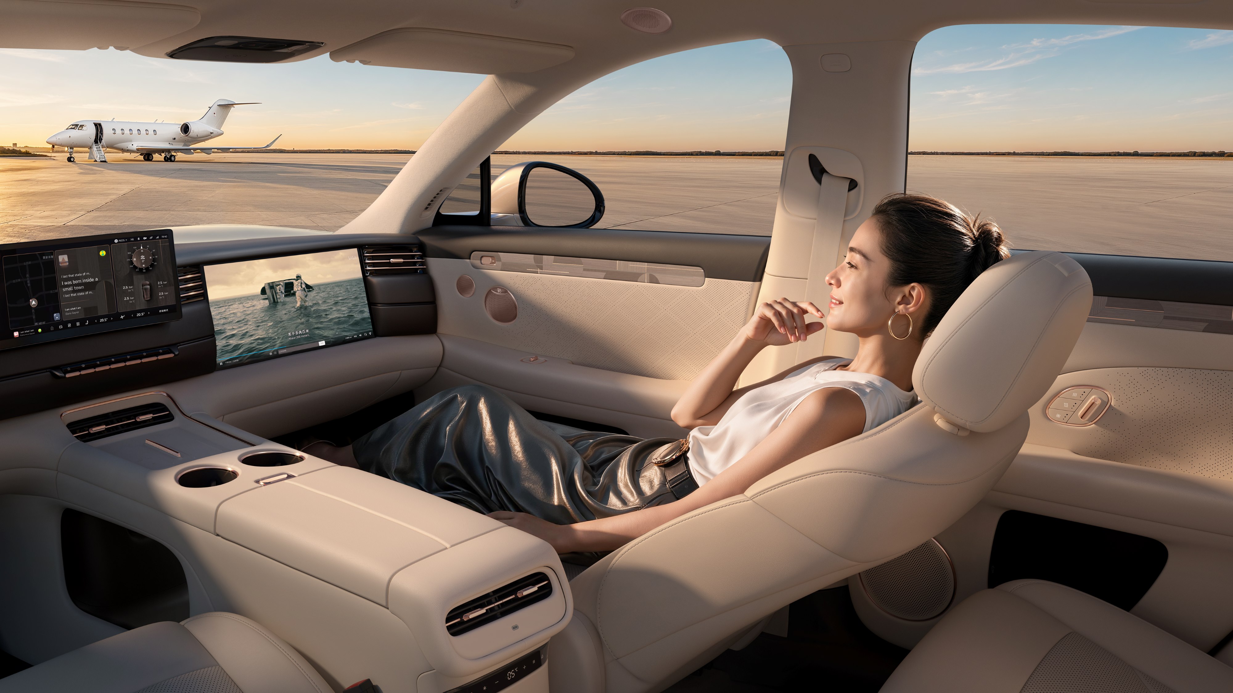 Rear cabin of the new-generation IM LS6 showing the reclining massage seat and rear entertainment display, an official IM Motors product photo