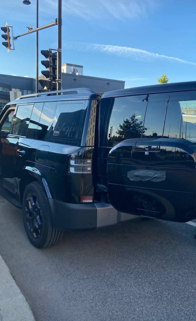 Rear three-quarter view of the black FangChengBao Bao 8 showing its boxy off-road styling and taped-over badging