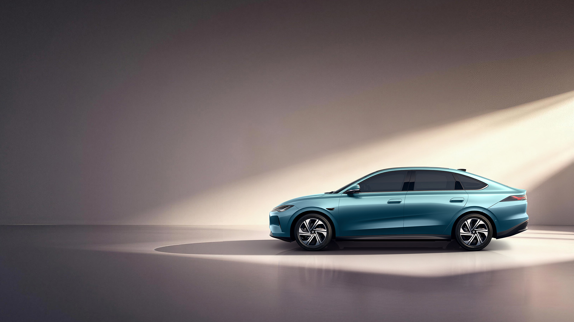 Official Jetta image of a teal M6 electric sedan in side profile against a studio-style backdrop, showing its fastback roofline and two-tone wheels