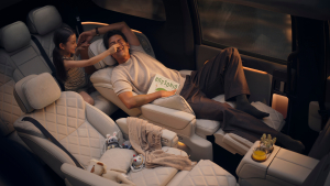 Family reclining in the new Li MEGA's zero-gravity second-row seats with the third row rotated to face them