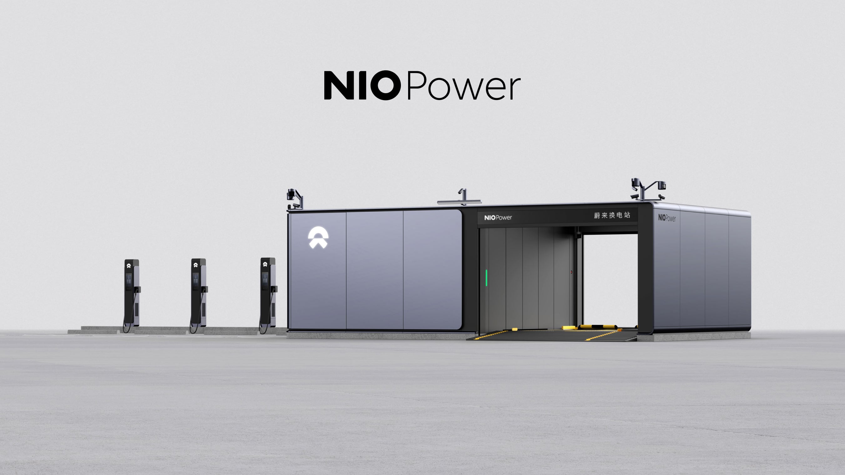 Rendering of a NIO Power swap station with three NIO charging posts lined up beside it on a plain grey backdrop