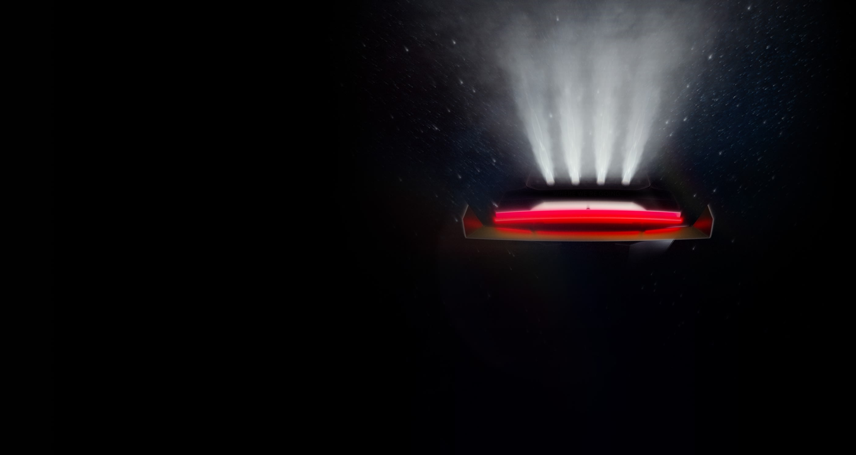 Tesla Roadster teaser rendering showing the rear light bar with jets of cold gas thrusters firing upward in darkness