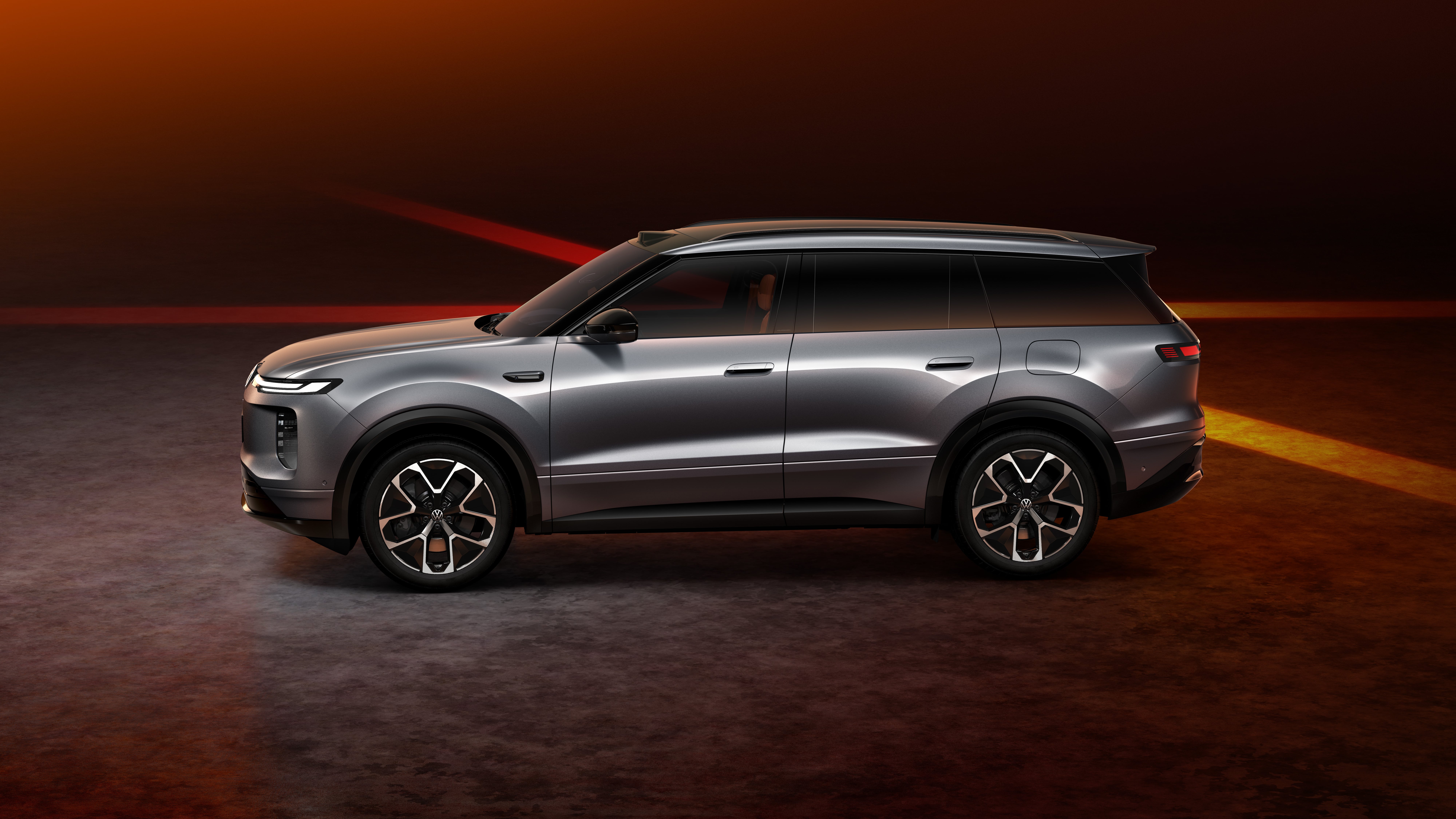 Silver SAIC Volkswagen ID. ERA 8X SUV in side studio profile with roof lidar pod and flush door handles