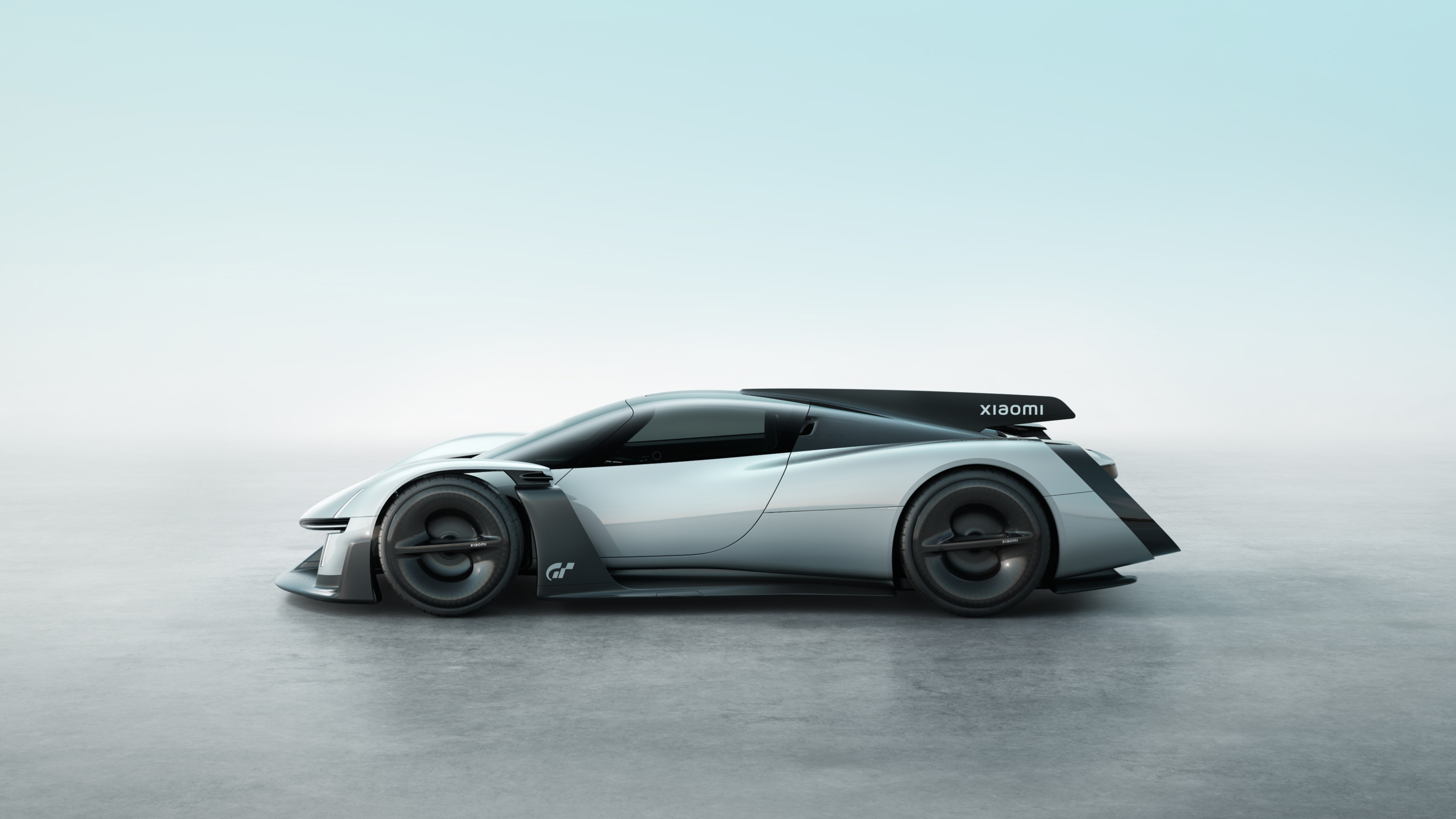 Side-profile rendering of the silver Xiaomi Vision Gran Turismo concept car on a plain studio background