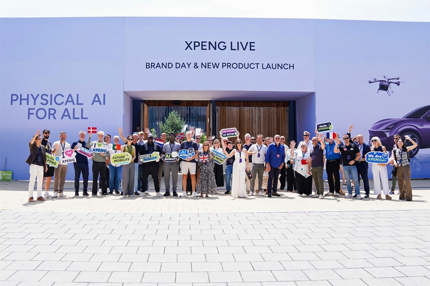 European XPeng owners and staff gathered outside the XPENG Live venue at the MONA L03's Munich launch event