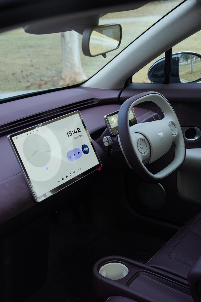 NIO Firefly cockpit showing the 13.2-inch center touchscreen, digital gauge cluster and crossbar-style steering wheel